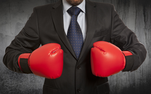 Fight against Addiction - man in suit with boxing gloves - willingway