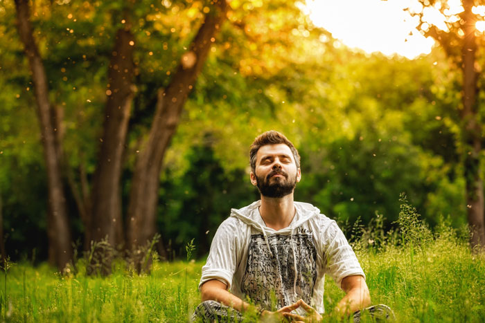 Man meditating outdoors - Ways to Prevent Relapse