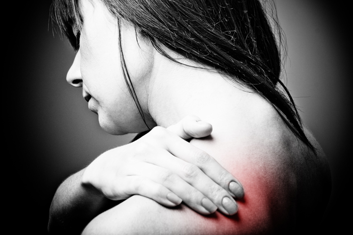 Treating Chronic Pain: When Opiates Aren't the Answer - grayscale woman hurt shoulder red added