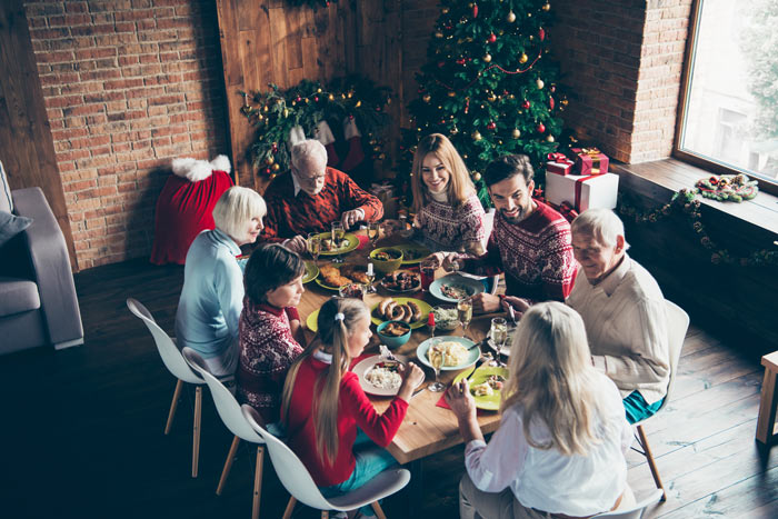 large family gathered around holiday meal - relatives
