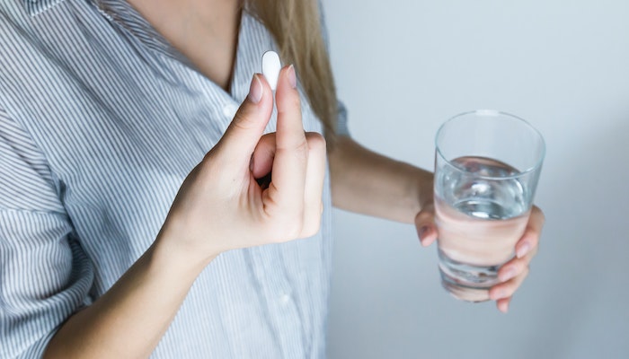 girl taking pill pills medicine valium addiction treatment